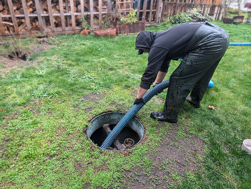 Septic Tank Being Pumped by a Technician